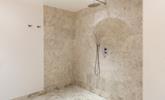 The ensuite from bedroom 4 has a walk-in wetroom which has a luxurious rain head shower. - Thumbnail Image
