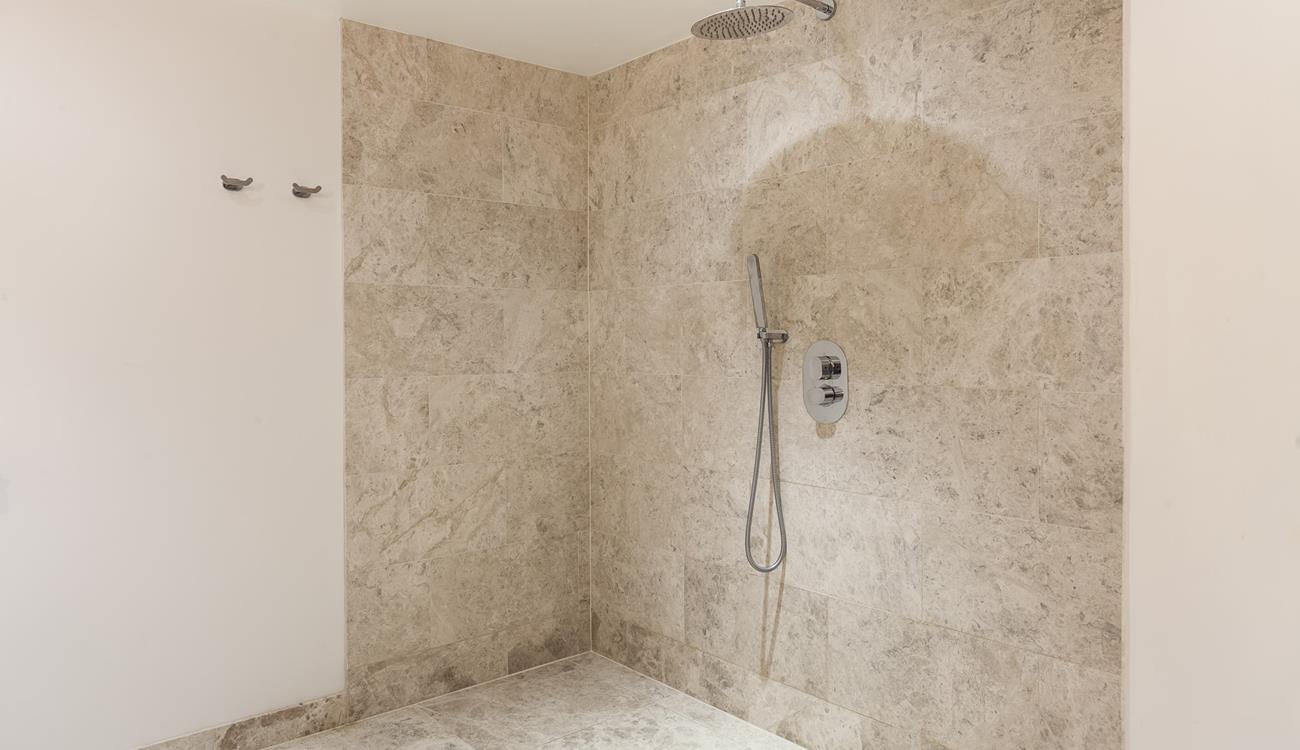 The ensuite from bedroom 4 has a walk-in wetroom which has a luxurious rain head shower.