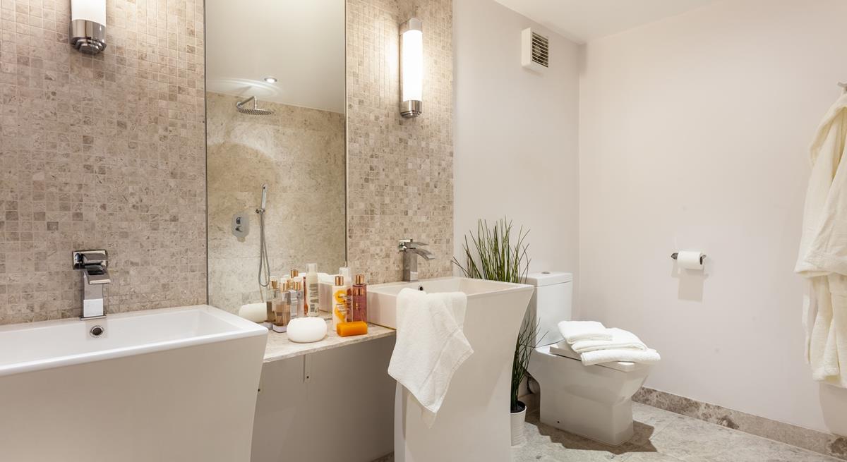 The ensuite from bedroom 4 has designer Jack and Jill washbasins.