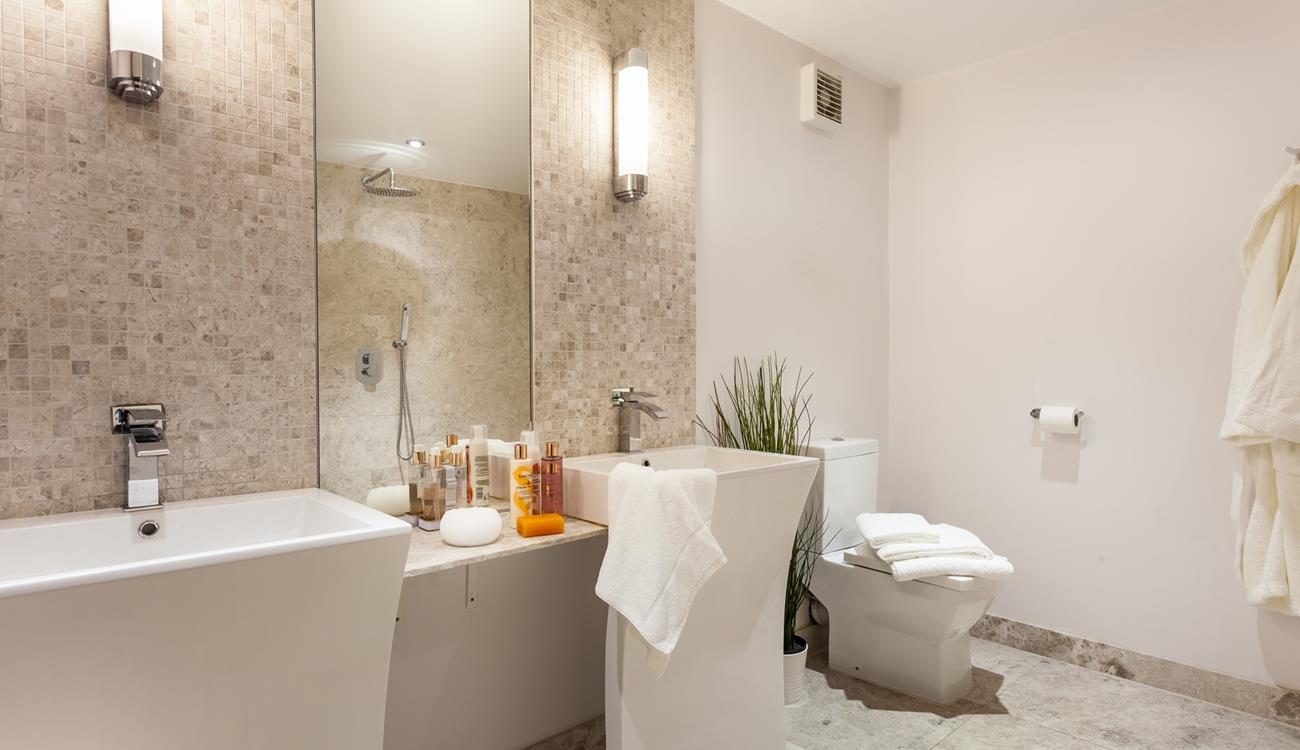 The ensuite from bedroom 4 has designer Jack and Jill washbasins.