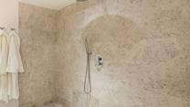 Beautiful tiling in the wetroom creates the ultimate spa experience.