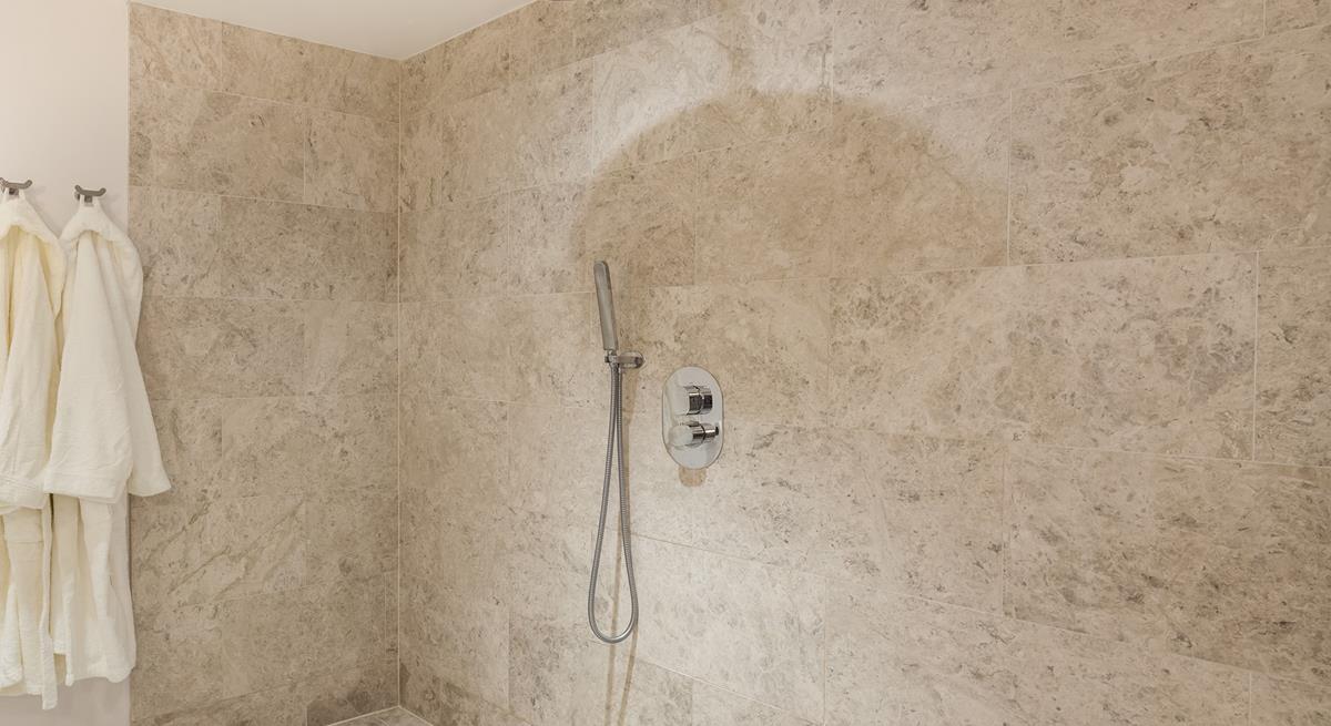 Beautiful tiling in the wetroom creates the ultimate spa experience.
