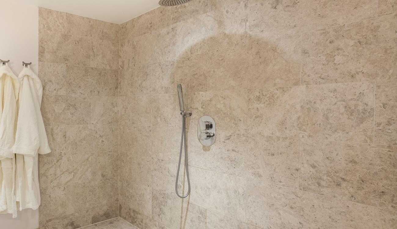 Beautiful tiling in the wetroom creates the ultimate spa experience.