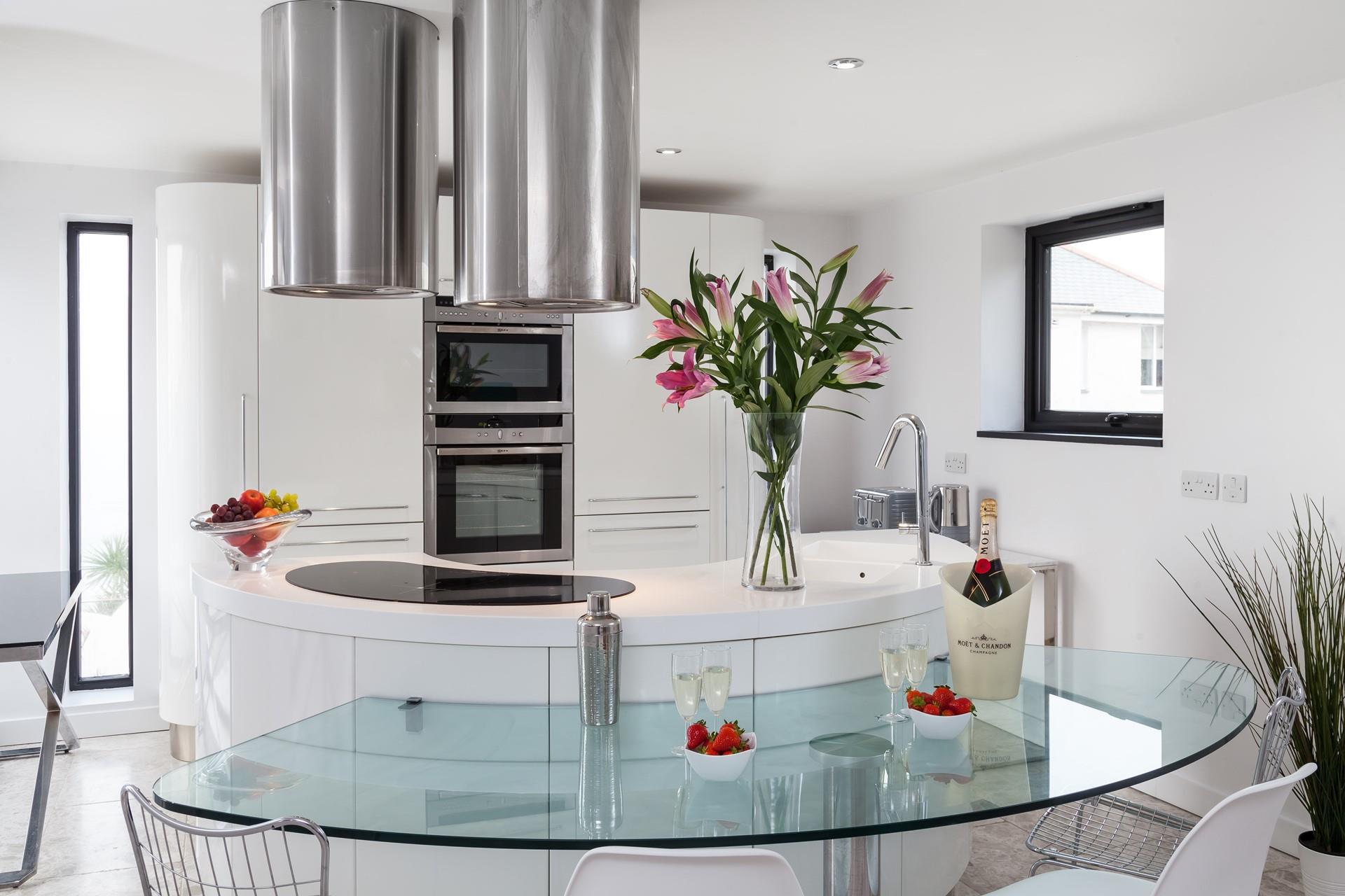 The contemporary kitchen is fully equipped to cook up a storm.