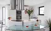 The contemporary kitchen is fully equipped to cook up a storm. - Thumbnail Image