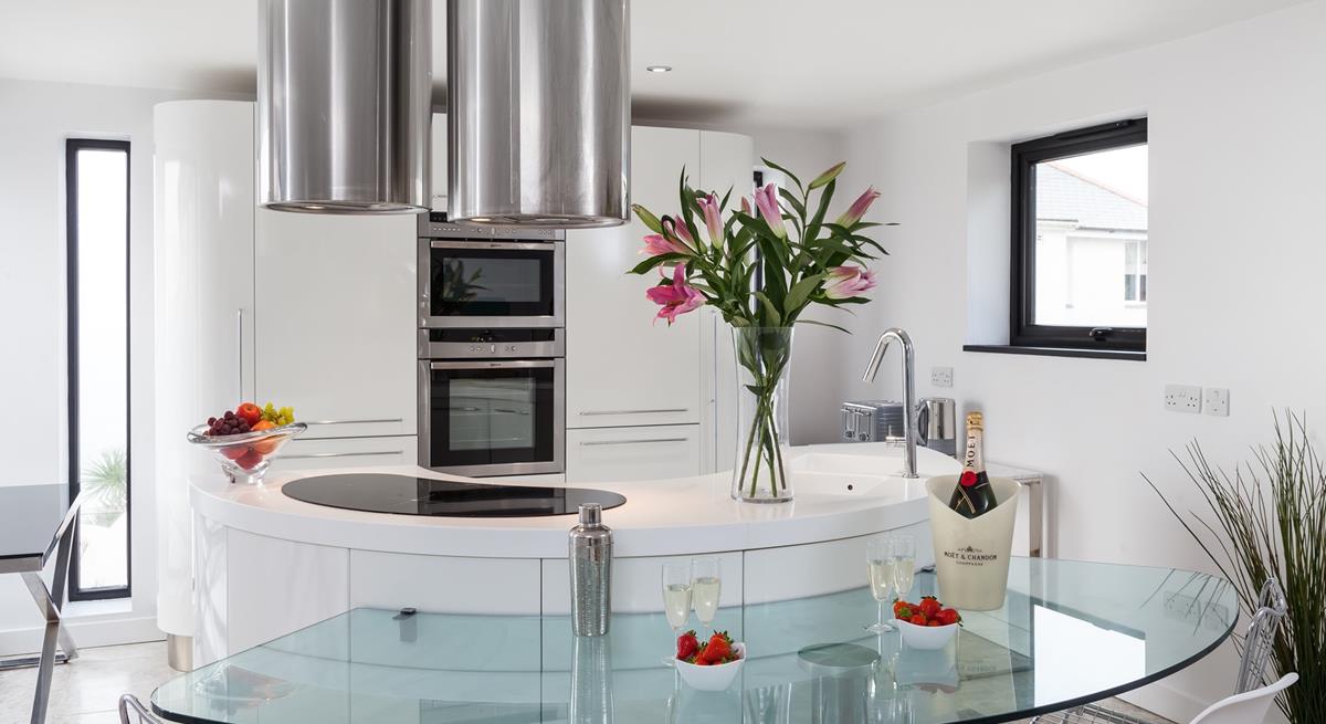 The contemporary kitchen is fully equipped to cook up a storm.
