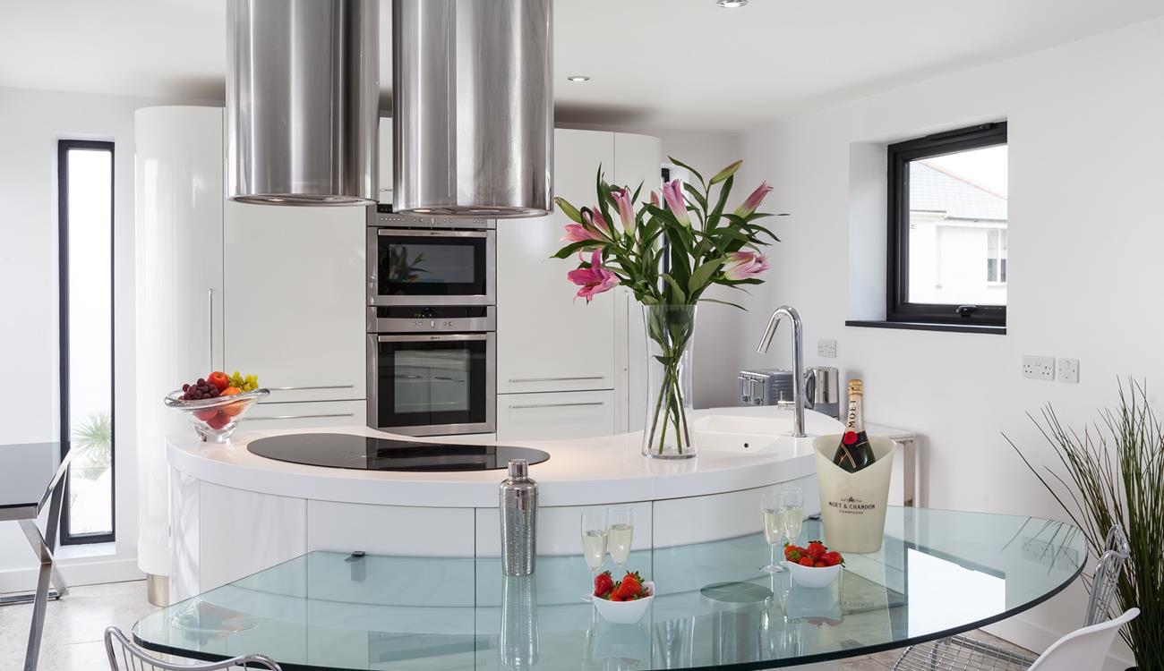 The contemporary kitchen is fully equipped to cook up a storm.