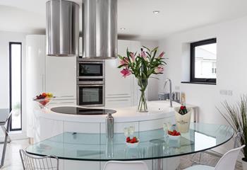 The contemporary kitchen is fully equipped to cook up a storm.