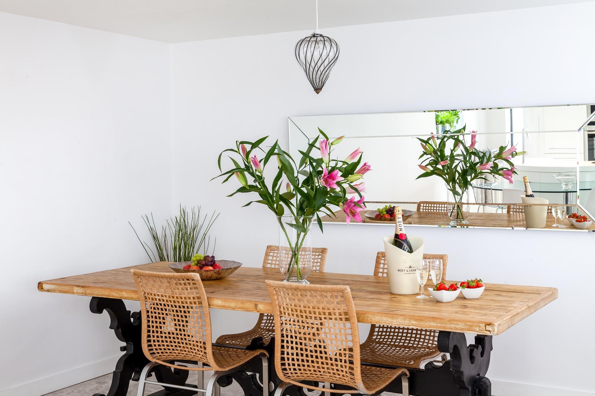 Gather around the stylish dining table and tuck into a tasty feast.