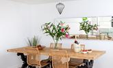 Gather around the stylish dining table and tuck into a tasty feast. - Thumbnail Image