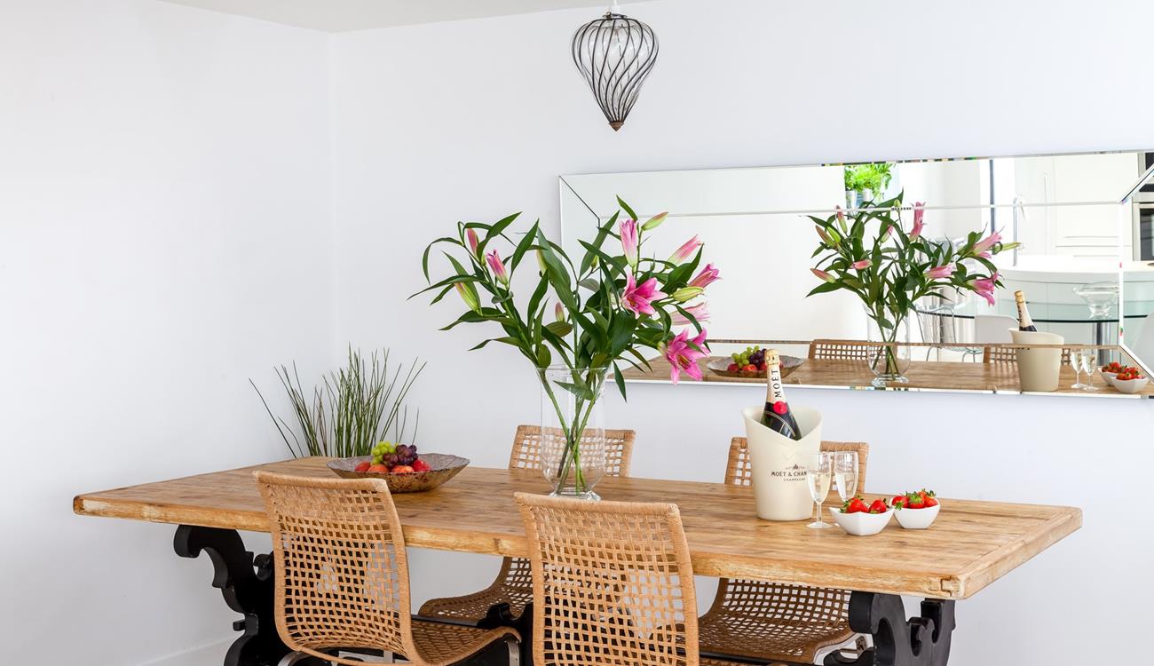 Gather around the stylish dining table and tuck into a tasty feast.