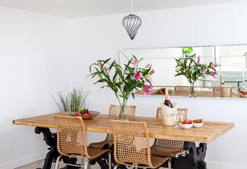 Gather around the stylish dining table and tuck into a tasty feast.