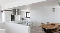 The rustic dining table compliments the contemporary feel of Higher Carthew.