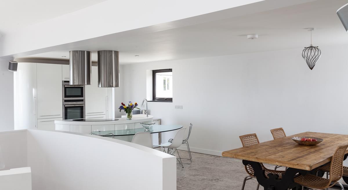 The rustic dining table compliments the contemporary feel of Higher Carthew.