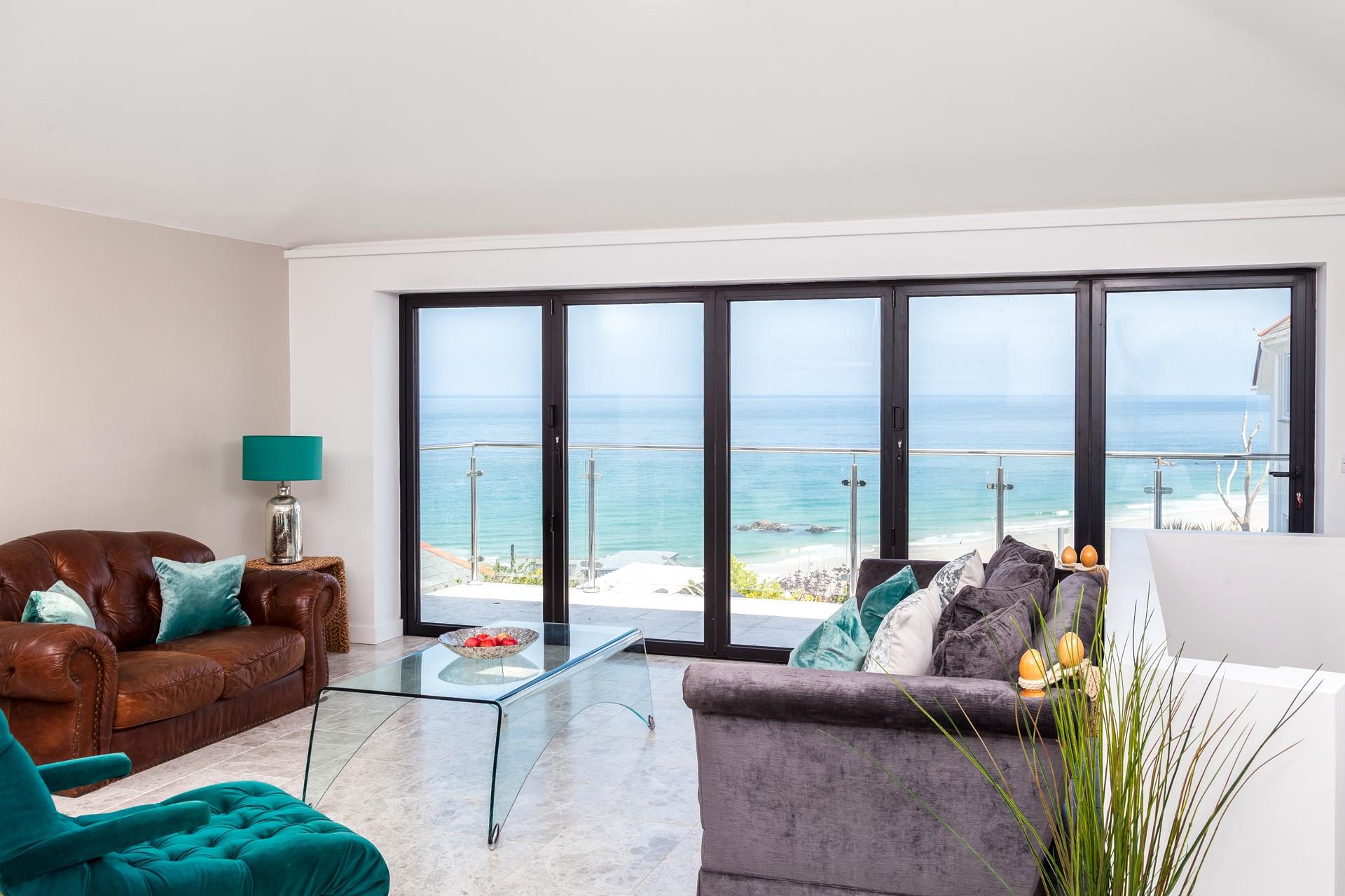 The sitting room takes advantage of the stunning views over Porthmeor.