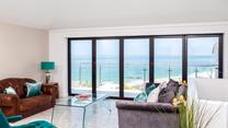 The sitting room takes advantage of the stunning views over Porthmeor.