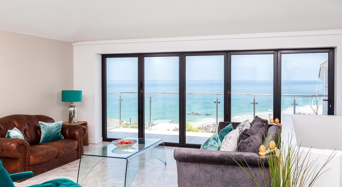 The sitting room takes advantage of the stunning views over Porthmeor.