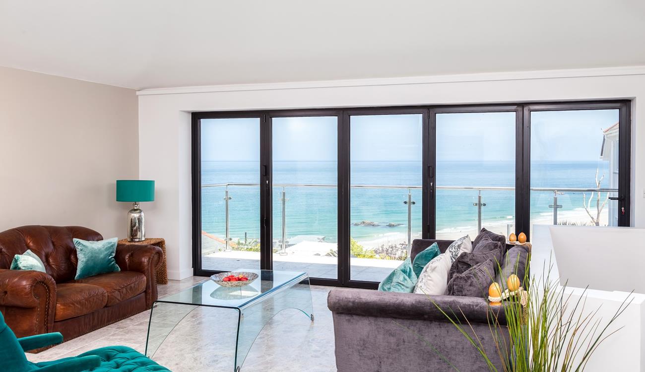 The sitting room takes advantage of the stunning views over Porthmeor.