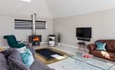 Light the contemporary woodburner and sink into relaxation mode. - Thumbnail Image