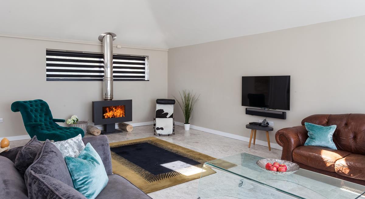 Light the contemporary woodburner and sink into relaxation mode.