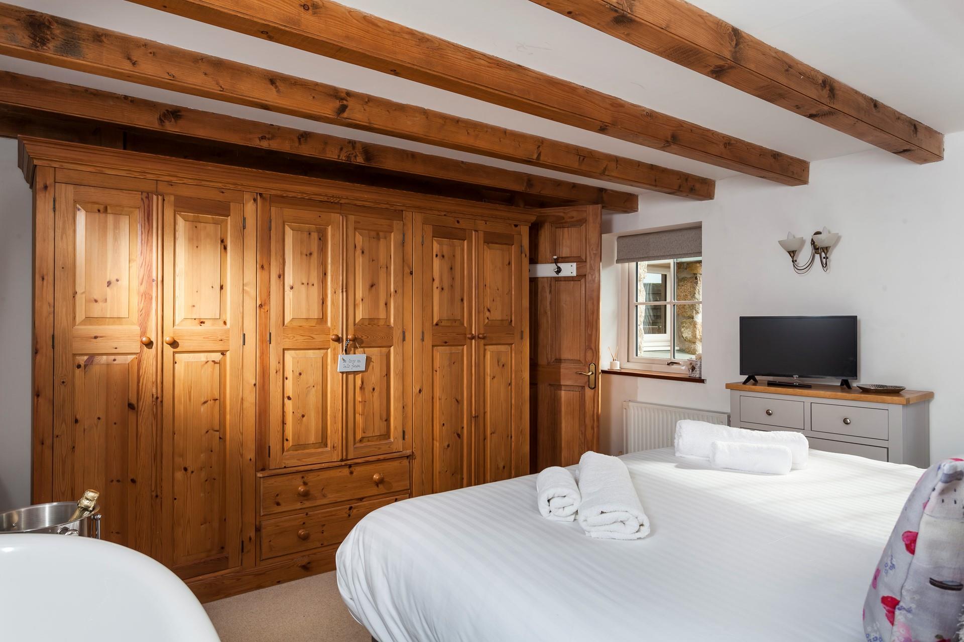 Large wooden wardrobes allow you to unpack your belongings and give you that home from home feeling.