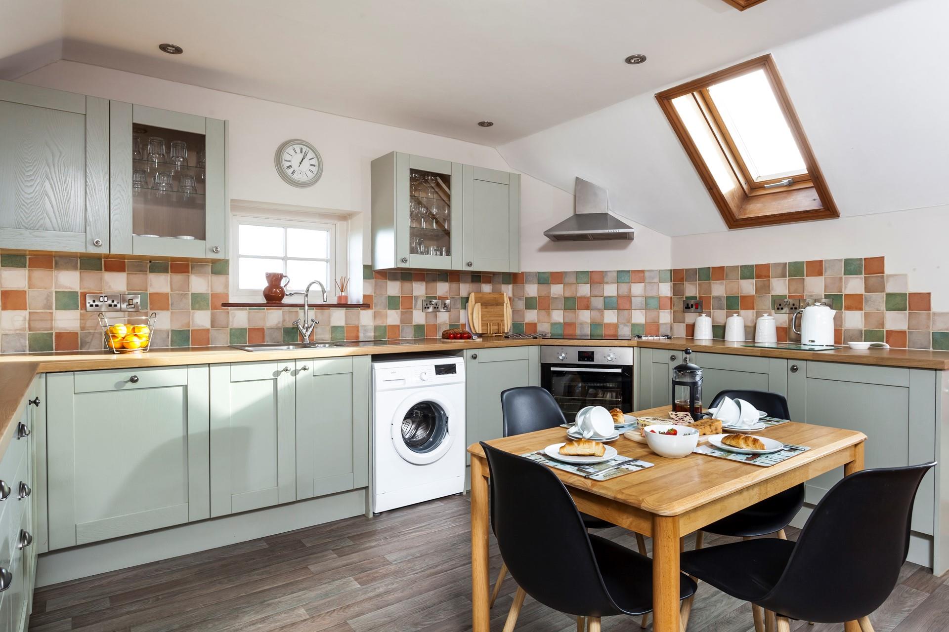 Beautifully finished, the olive country style kitchen has all you need to rustle up a feast. 