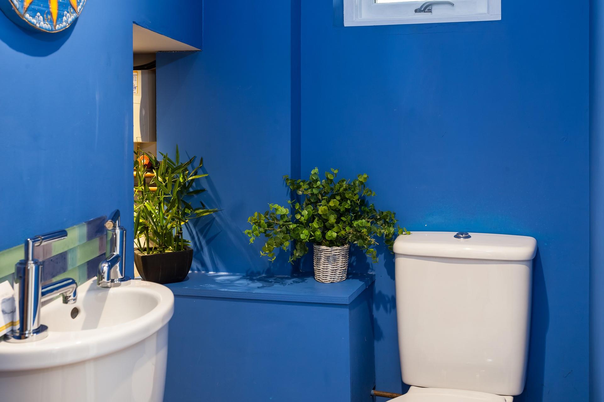 The cloakroom has a basin and WC, and also a handy washing machine to use during your stay. 