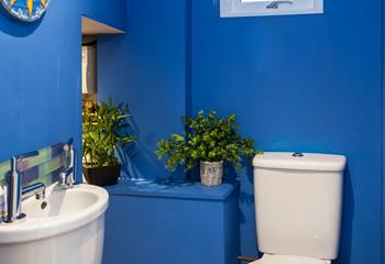 The cloakroom has a basin and WC, and also a handy washing machine to use during your stay. 
