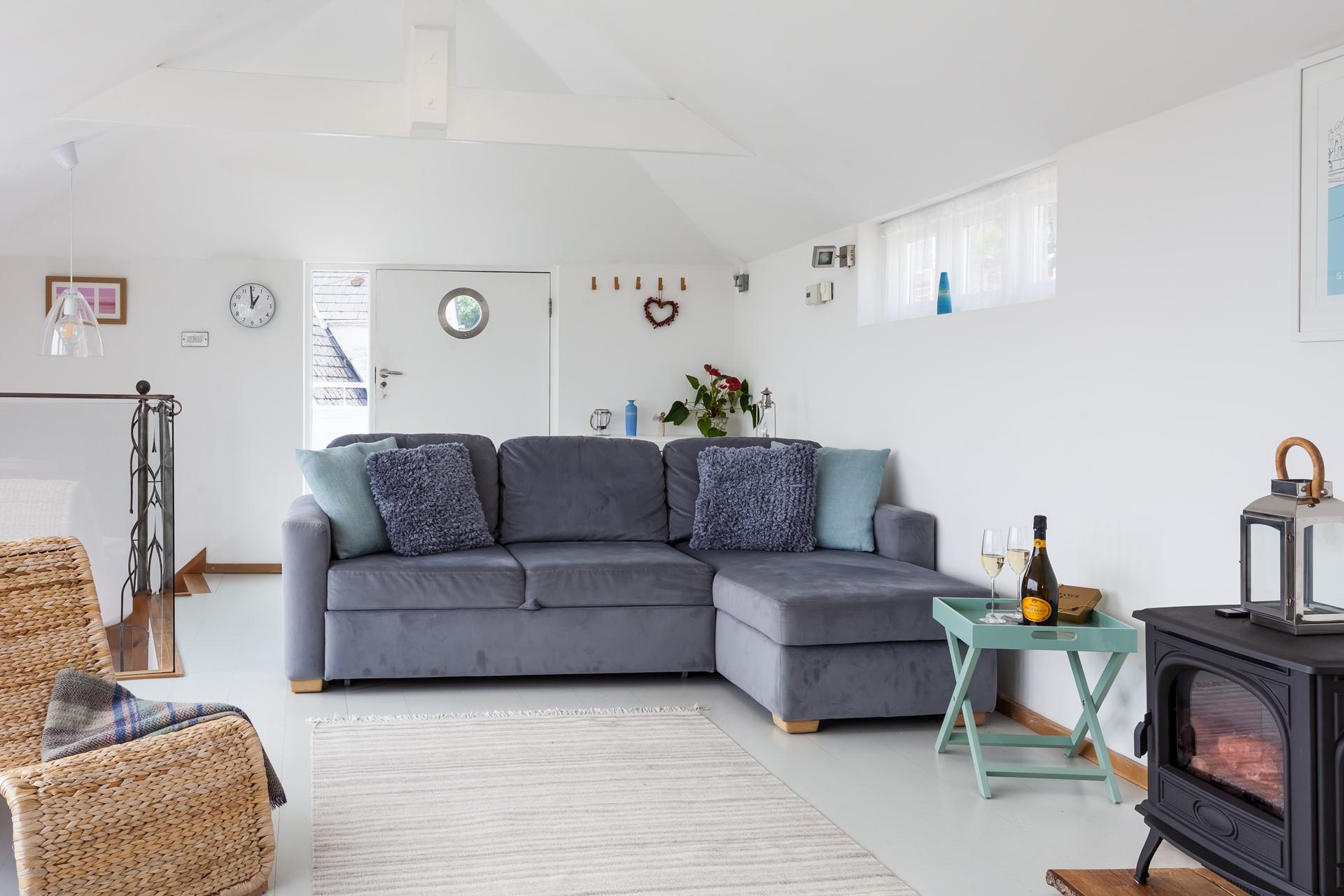 The cosy sitting room provides the perfect space to relax in the evening in front of the woodburner.