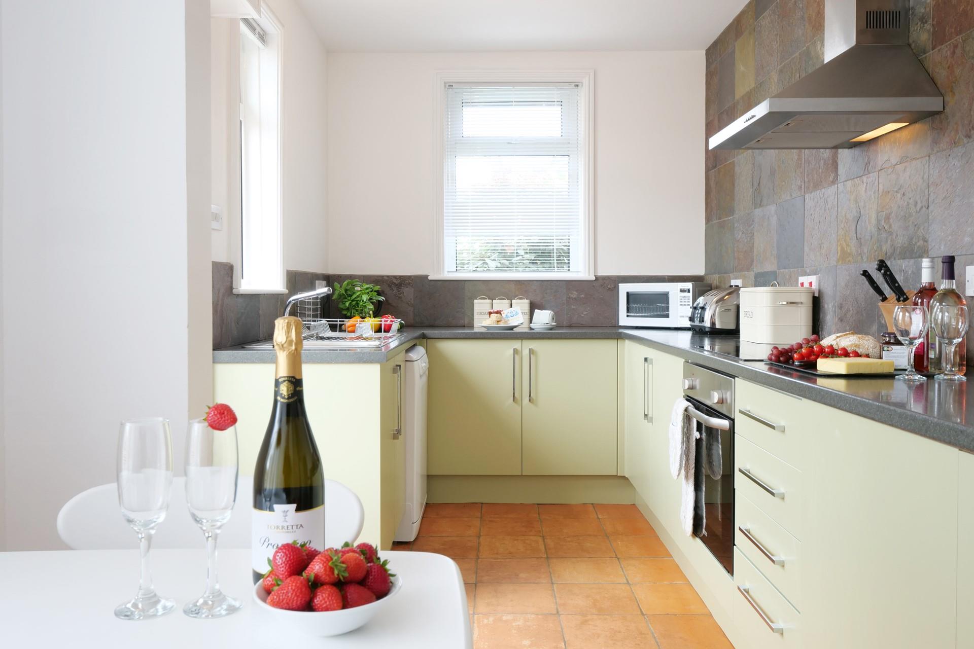 The kitchen is modern and fully equipped for cooking tasty feasts.