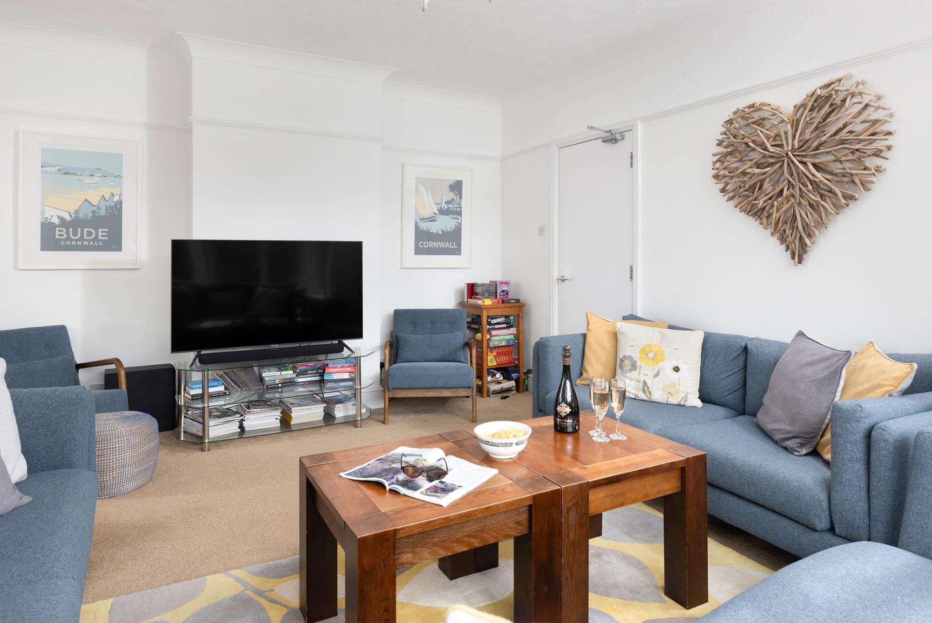 The sitting area is decorated in pretty coastal hues.