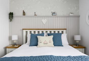 Cute nautical touches in the bedroom give it a relaxing feel. 