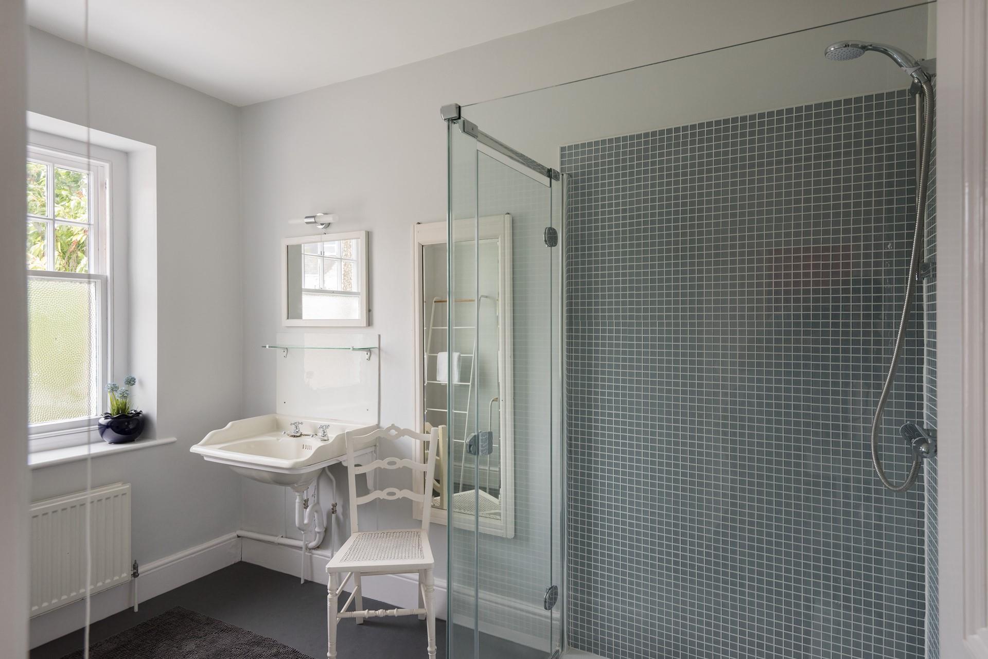 The family shower room on the first floor has a large walk-in shower, perfect for washing away the sand after a day on the beach.