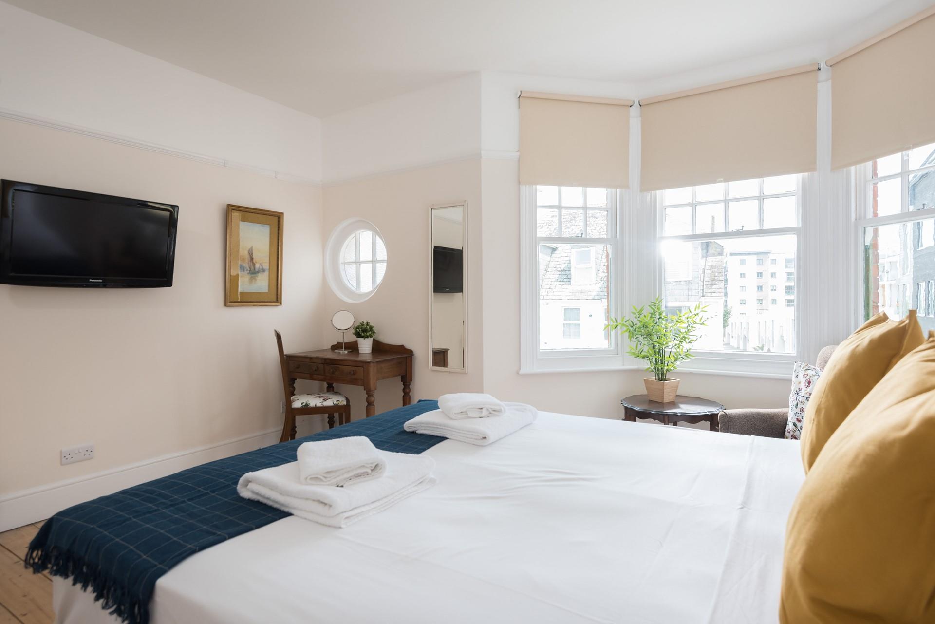 You can sit and write a postcard at the quaint desk in bedroom 3. 