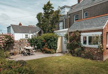 Climbing roses add to the houses elegance and grandeur. 