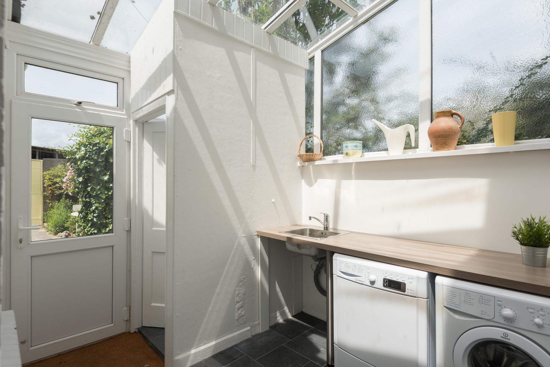 The utility room leads out to the garden and is great for storing boots and bodyboards in.