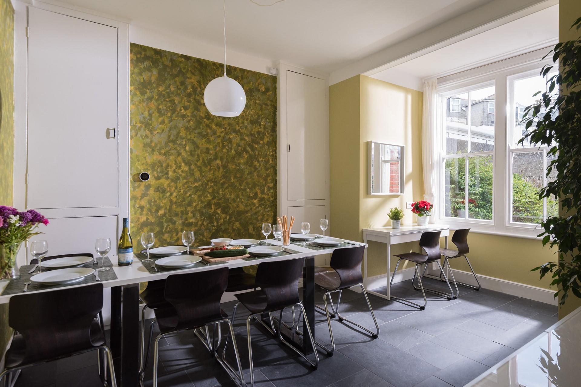 The dining room with unique, quirky decor, looks out onto the garden so you can enjoy breakfast as the children play outside.