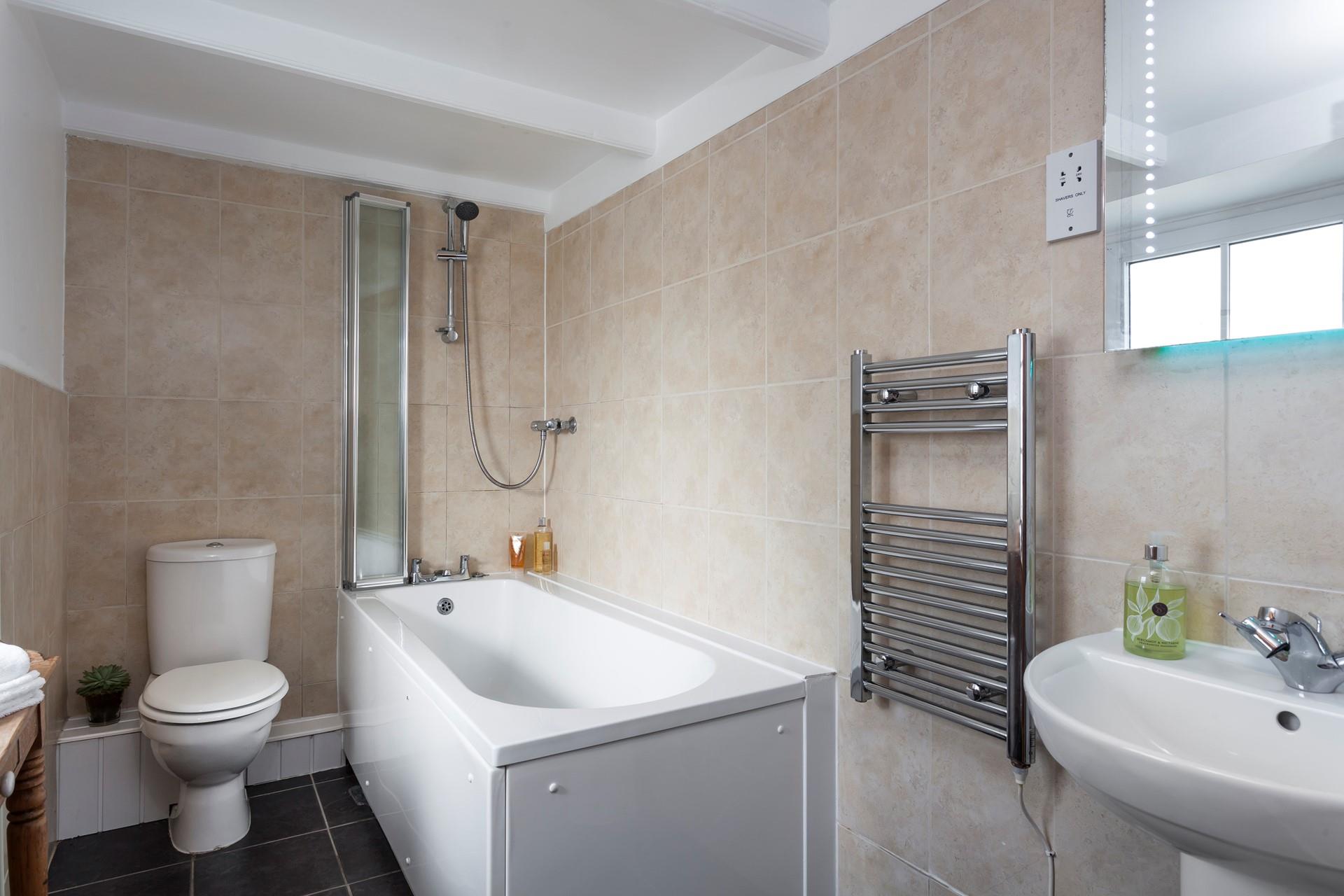 Start the day with an invigorating shower with warm fluffy towels straight from the rail.