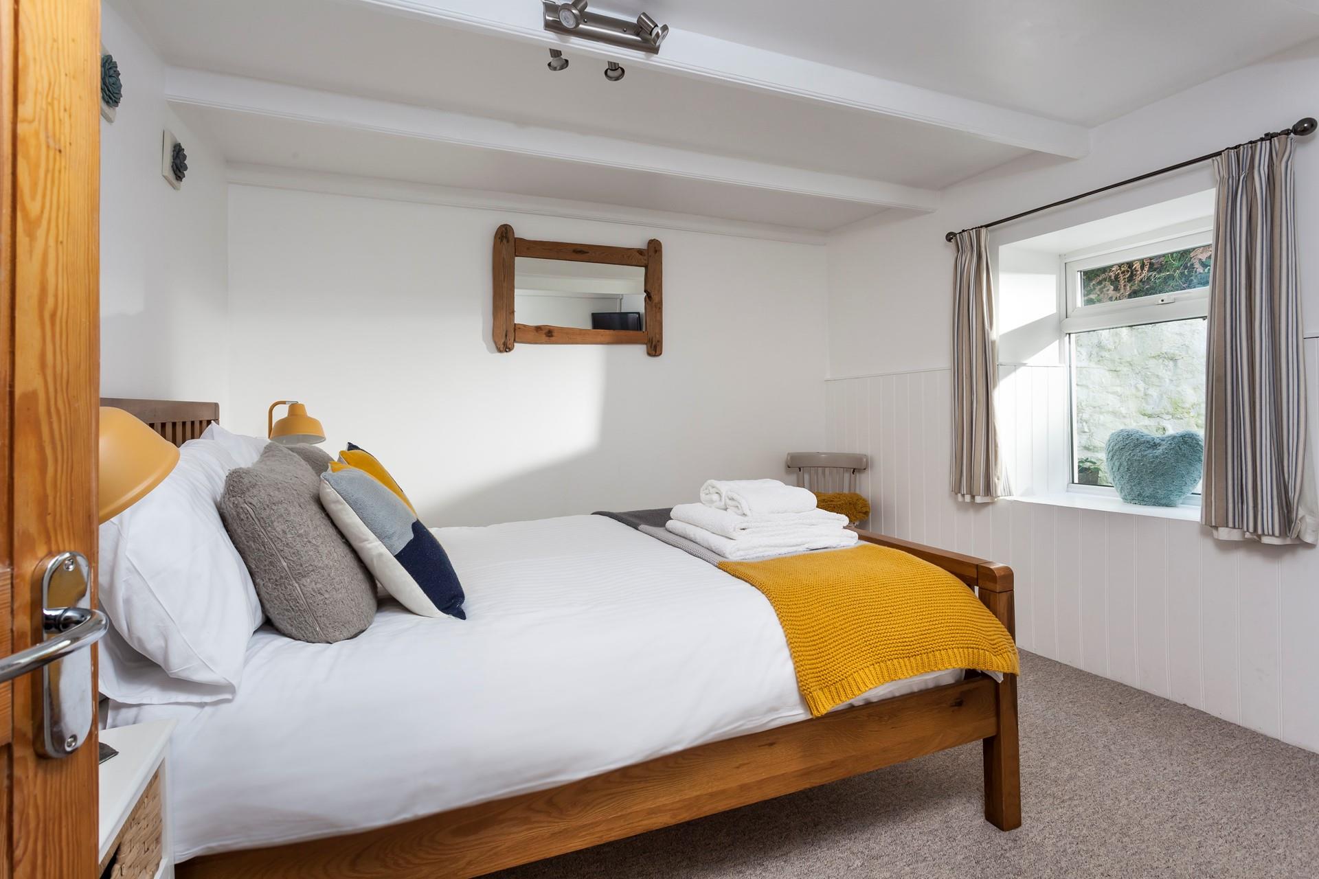Bedroom 1 has a spacious double bed for a blissful night's sleep.