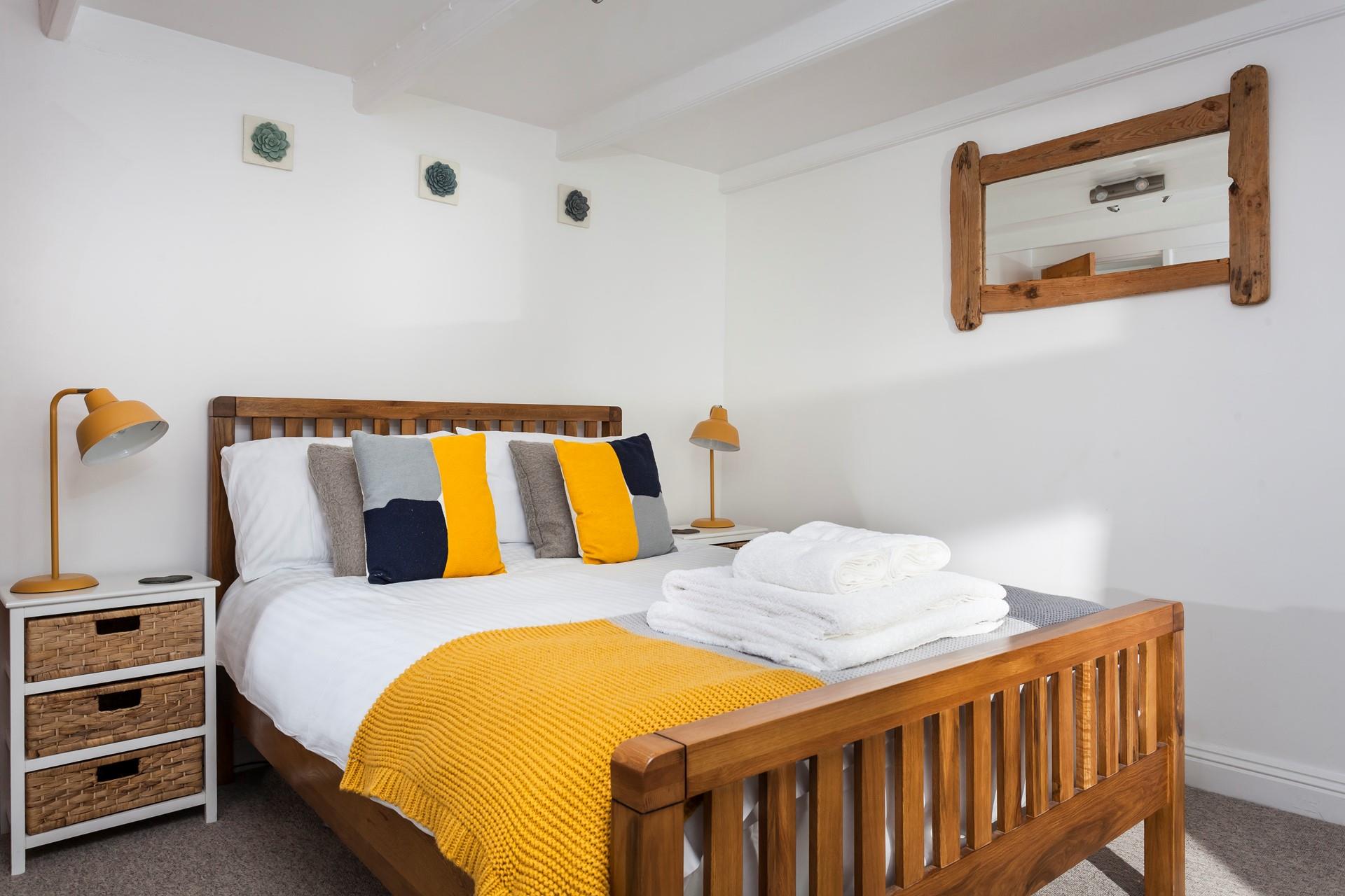 Bright colours fill the bedroom which offers a lovely space to rest your head.