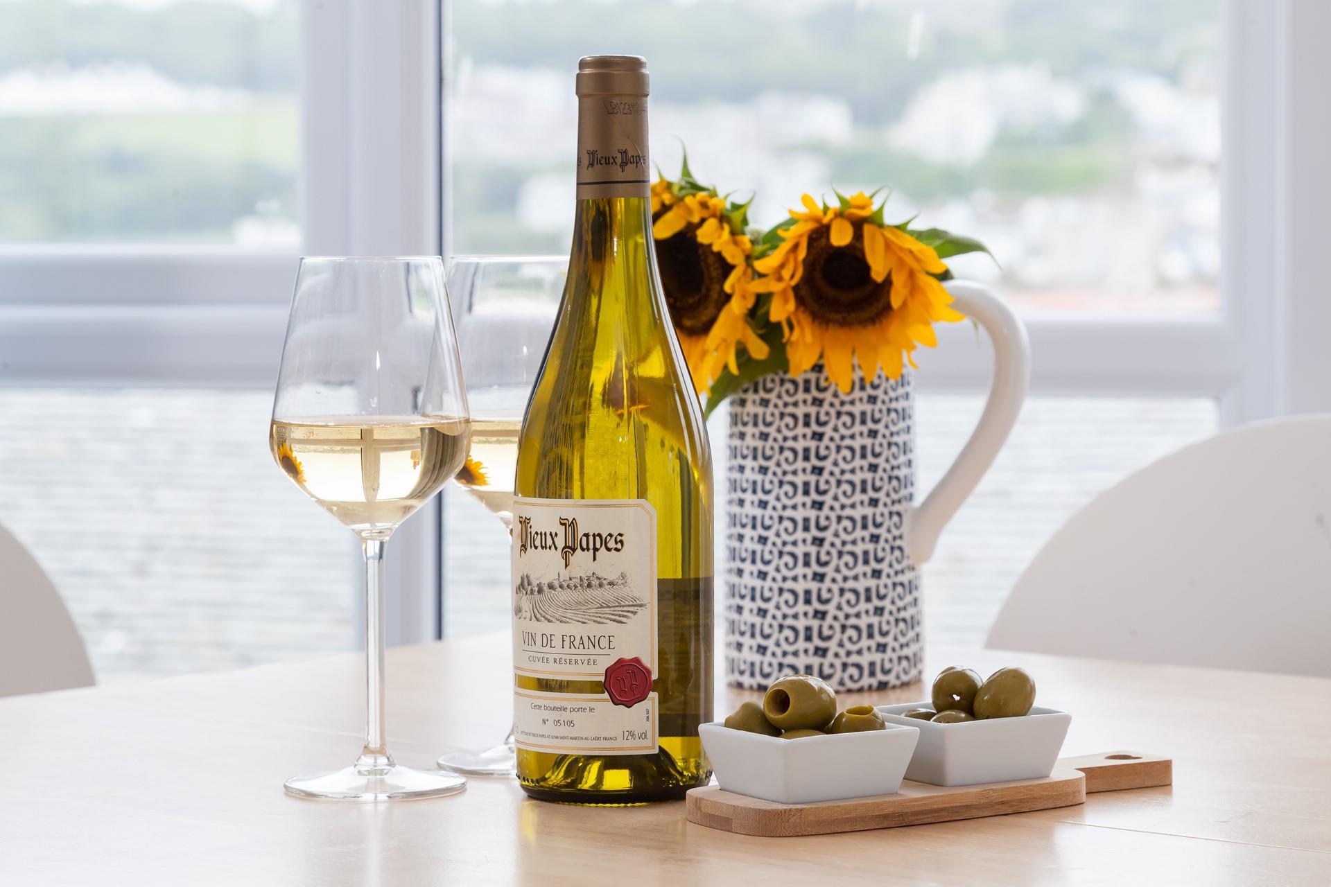 As the sun sets, enjoy a glass of wine and some olives from the nearby deli. 