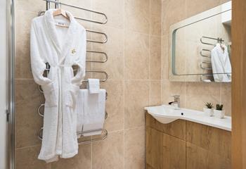 Modern and stylish, the en suite features a large walk-in shower. 