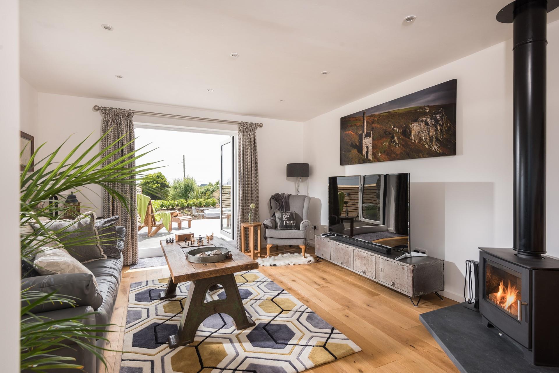 Watch your favourite boxset on the 65" Smart TV, while the fire roars. 