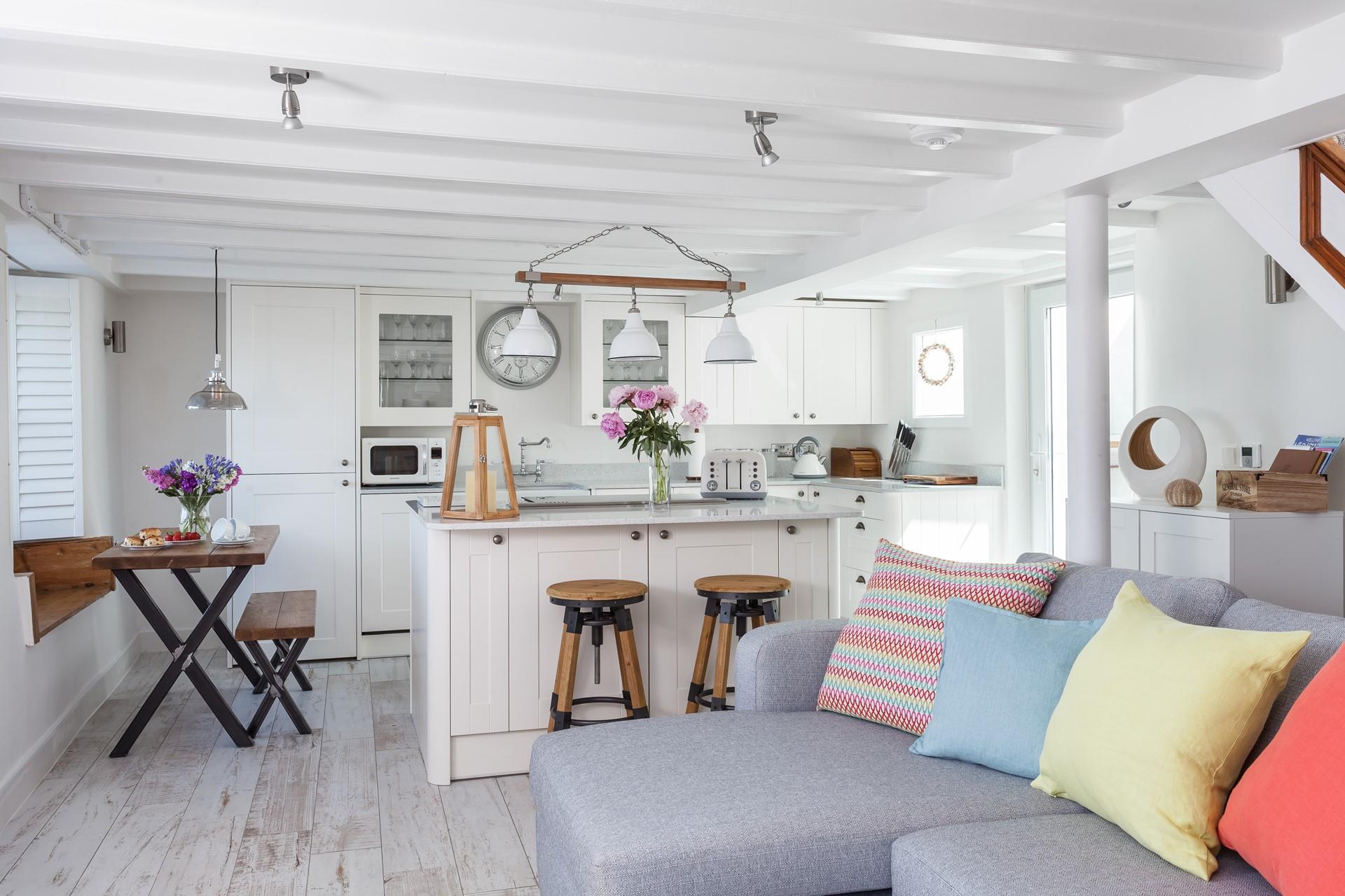 The property is a stunning fusion of traditional and modern furnishings, seamlessly blending neutrals with pops of colour.