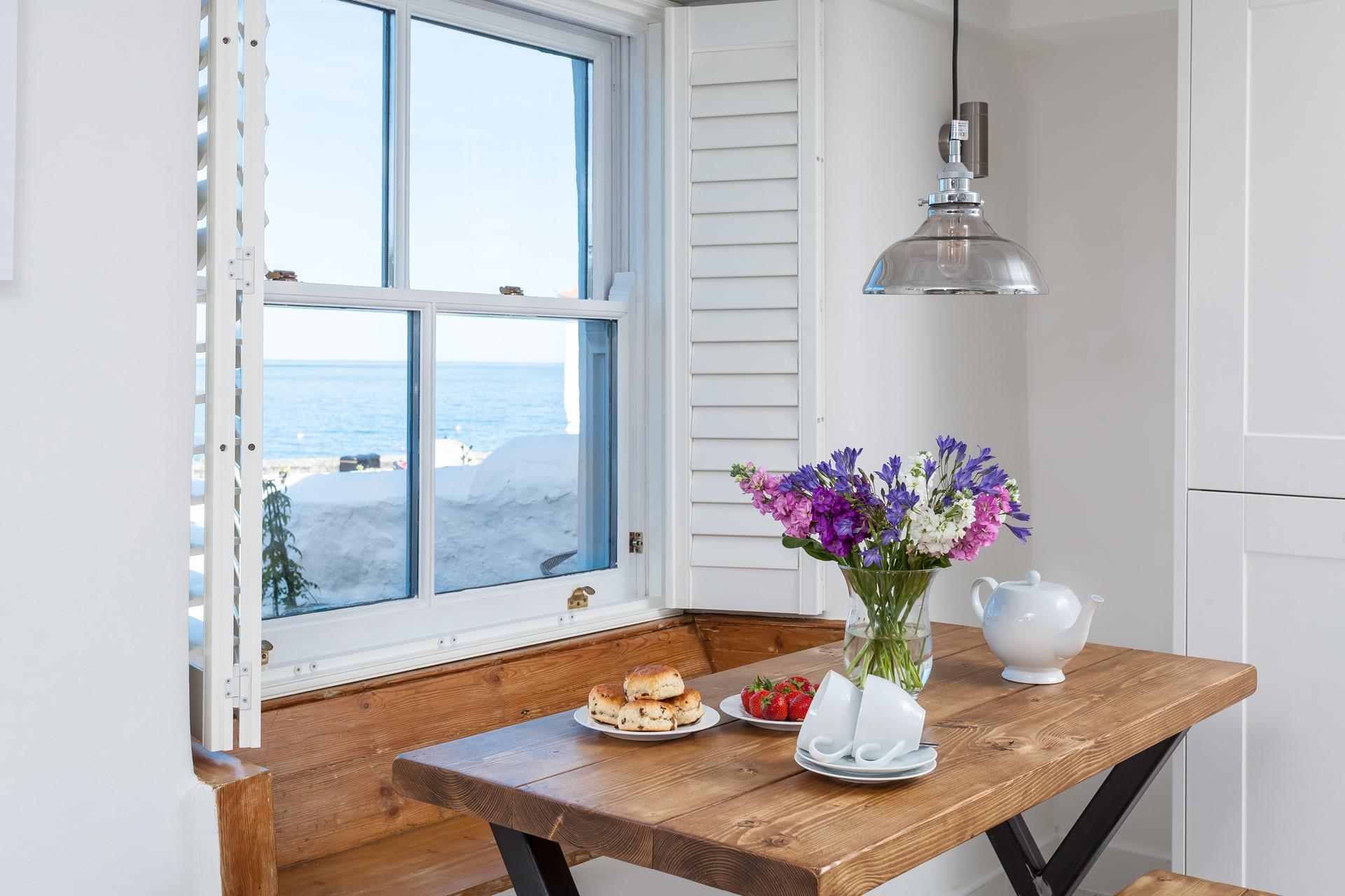 Sip your morning coffee whilst gazing out at Coverack's picturesque harbour. 