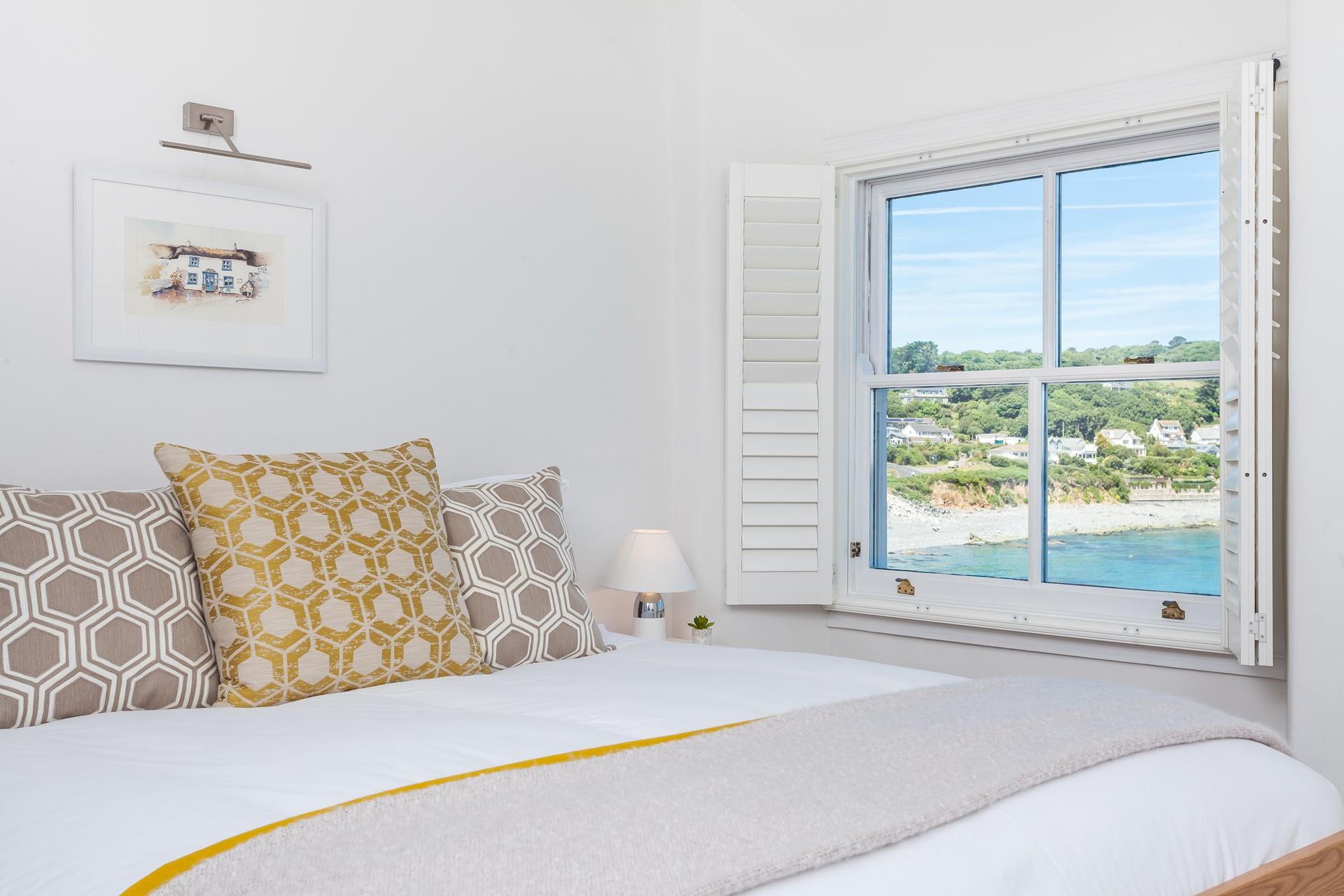 Make a generous mug of your favourite hot drink and treat yourself to a lazy morning in bed just watching the waves.