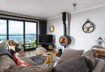 The circular woodburner is a real centre piece in this room with a clever and sleek design, perfect for chillier days.