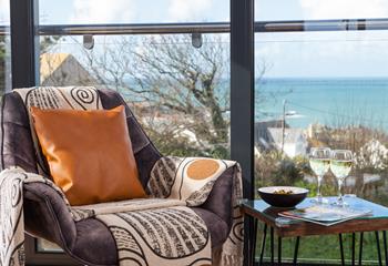 The living room has fantastic views over Porthmeor, you can slide open the sliding doors to reveal a private Juliette balcony and let the sea air in.