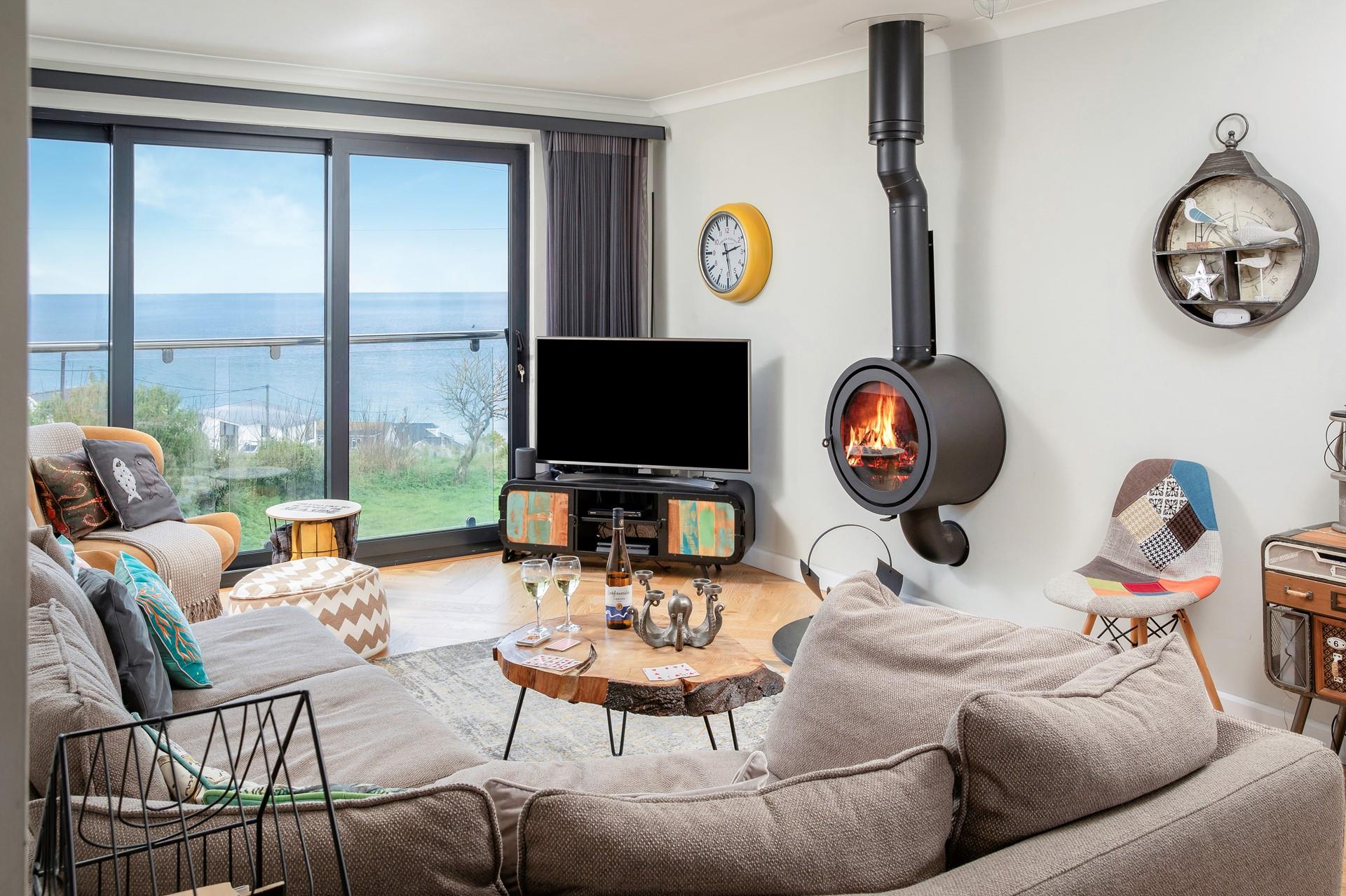 The circular woodburner is a real centre piece in this room with a clever and sleek design, perfect for chillier days.