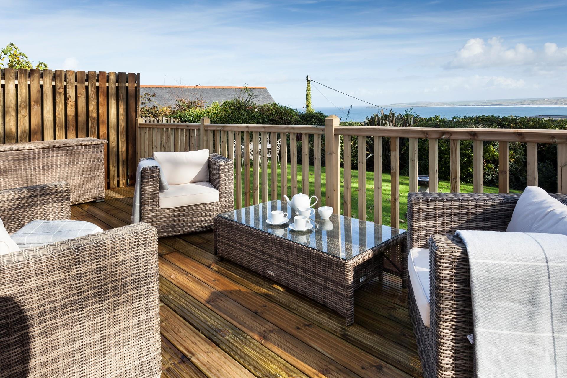A picture-perfect view; the French doors from the living area lead to the private terrace with far-reaching sea views. 